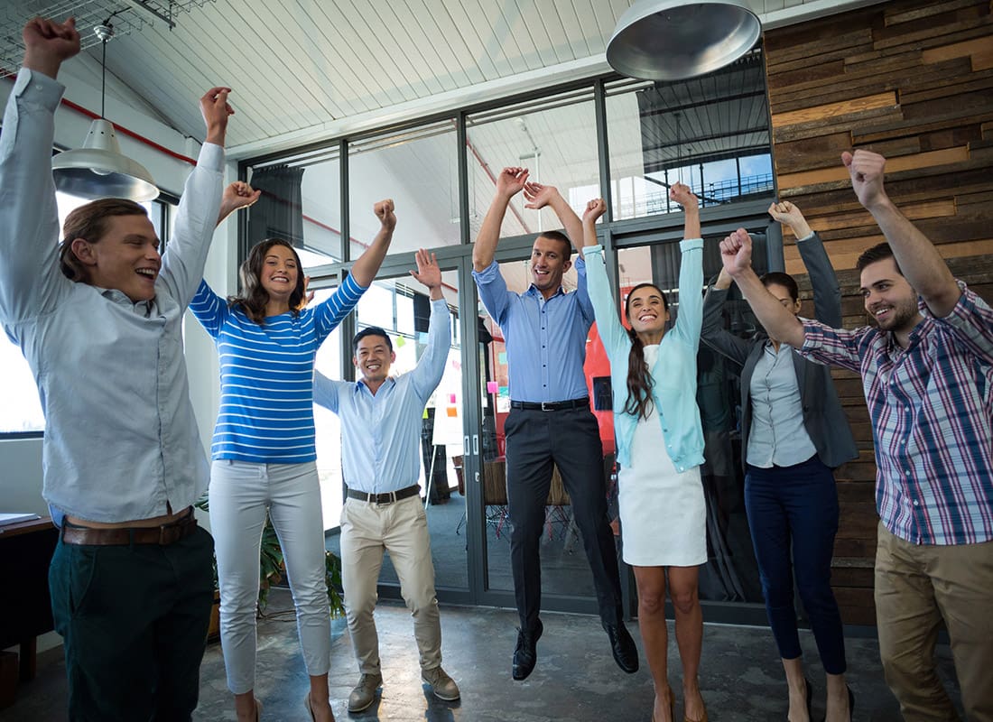 Read Our Reviews - Group of Professionals Cheering Together in an Office
