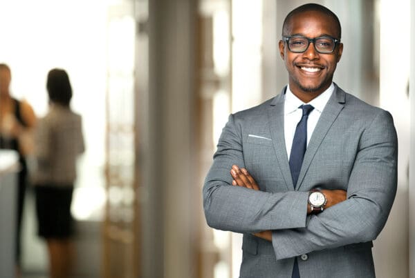 We Are Independent - Friendly Business Man Standing in an Office